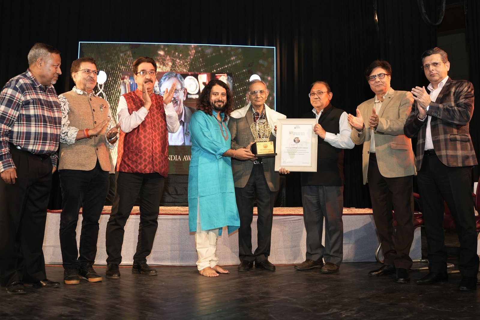 Felicitation on stage at the Harmony India Awards