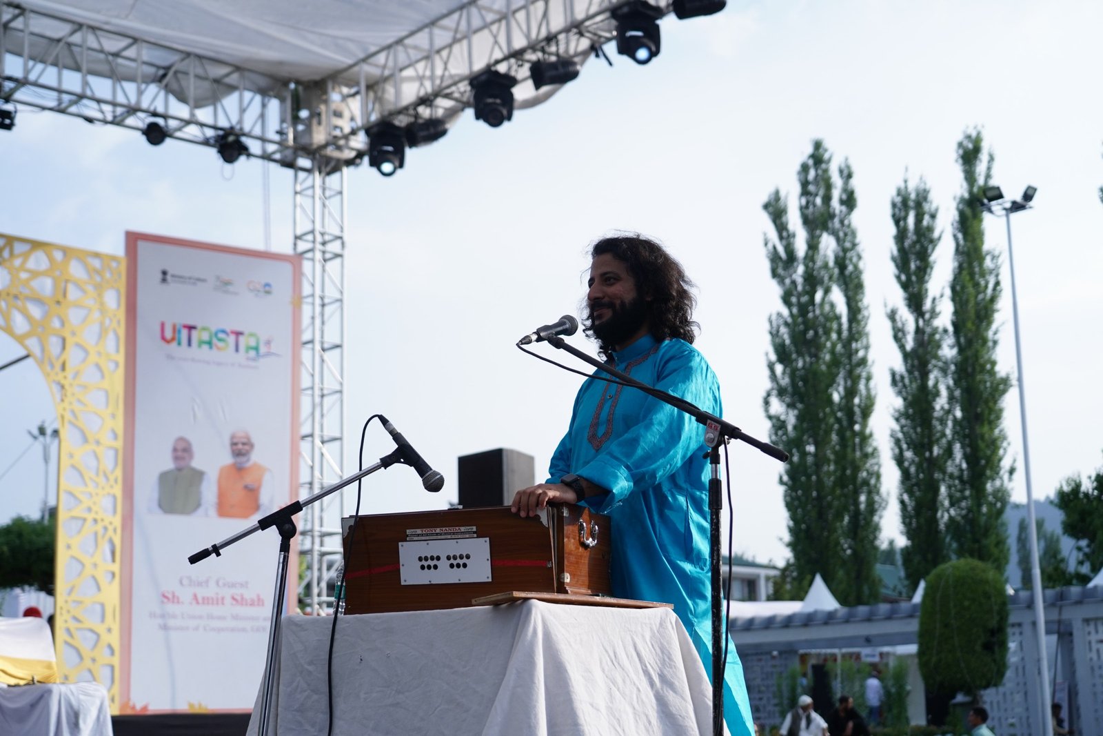 Saurabh Zadoo performing at an open-air festival stage in Kashmir